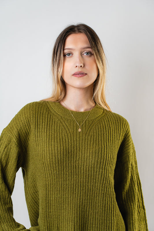Close-up of the Betty Cooper Ribbed Sweater in olive green.