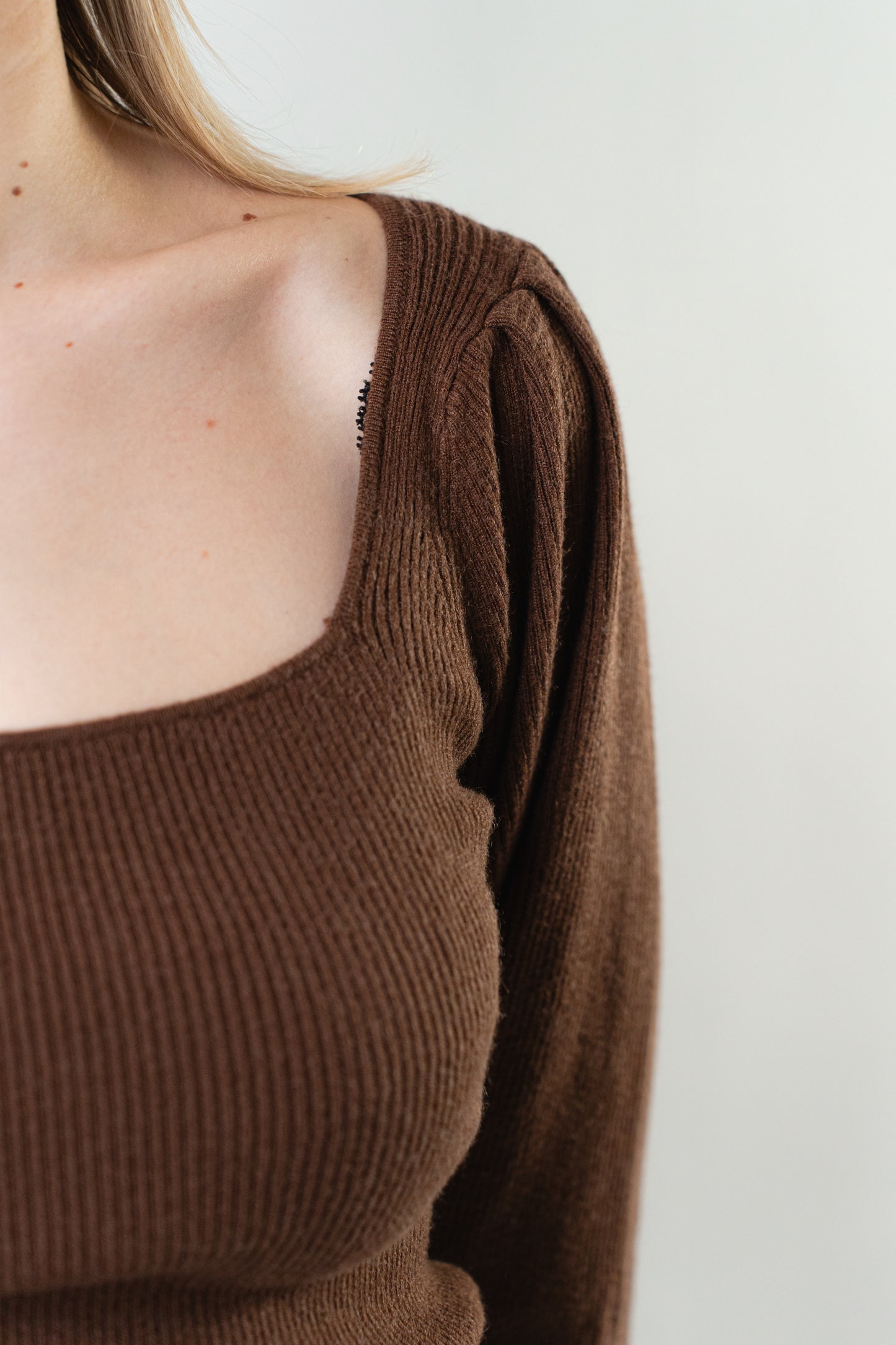 Close-up of the Elise Square Knit Top in brown, showing the ribbed knit texture and square neckline.